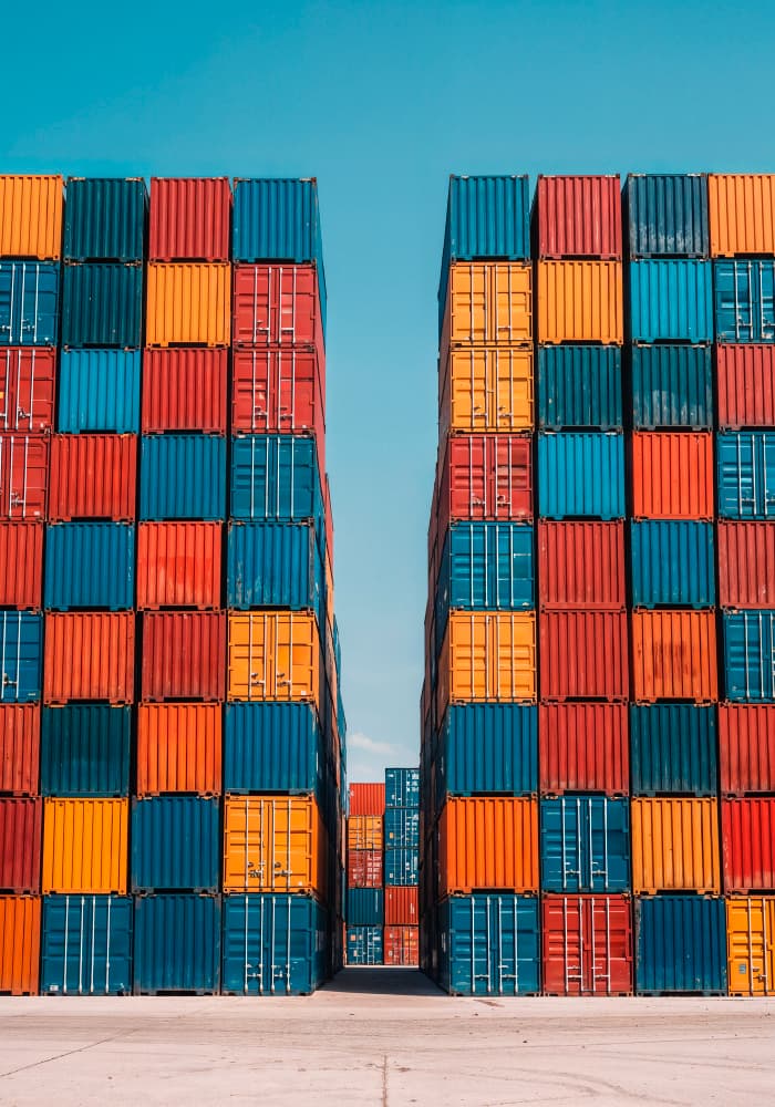 Shipping containers stacked vertically and horizontally